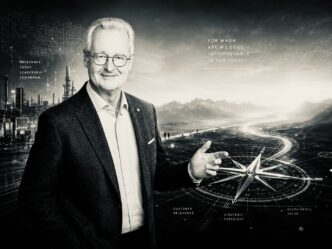 Portrait of a smiling man in a suit before a futuristic landscape with a compass, symbolizing leadership and foresight in business.