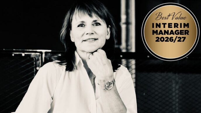 Black-and-white portrait of a smiling woman with her hand on her chin, next to a gold circular badge reading ‘Best Value Interim Manager 2026/27’.
