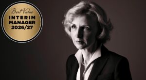 Black-and-white portrait of a professional woman in a suit with a gold circular badge reading 'Best Value Interim Manager 2026/27' on the left.